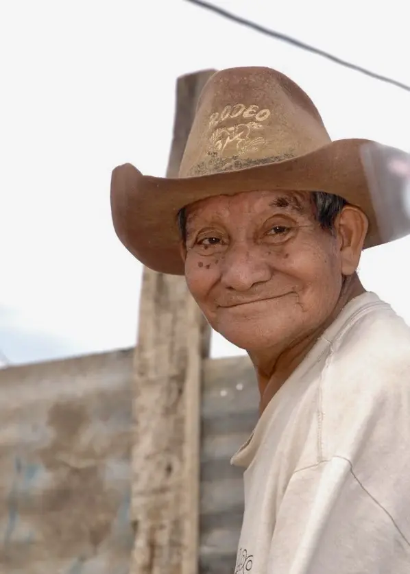 Older man in a straw cowboy hat